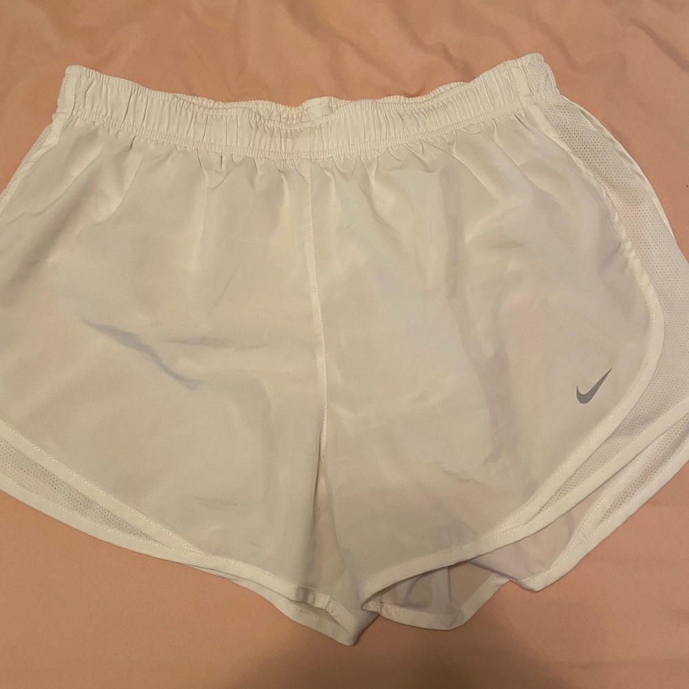 White Nike running shorts